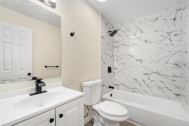 full bathroom with vanity, tiled shower / bath combo, and toilet