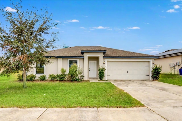 view of front of house featuring a garage and a front yard