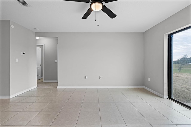 tiled empty room with ceiling fan