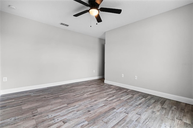 spare room featuring ceiling fan and hardwood / wood-style floors