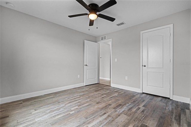 unfurnished bedroom with hardwood / wood-style floors and ceiling fan