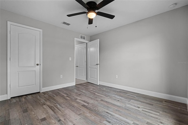 unfurnished bedroom with ceiling fan and light wood-type flooring