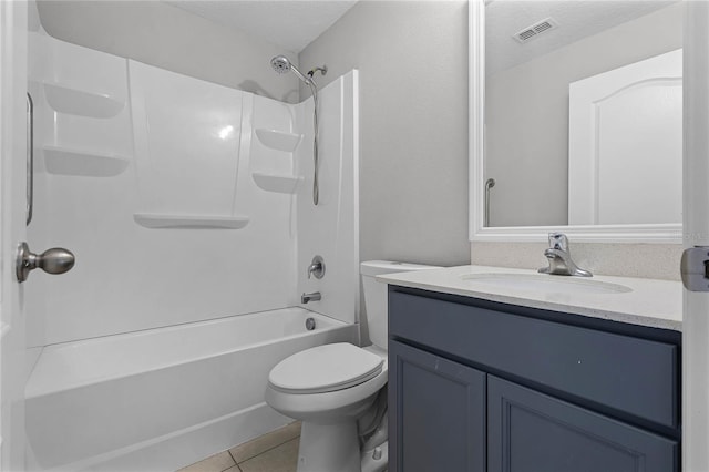 full bathroom with tile patterned floors, toilet, a textured ceiling, vanity, and shower / bath combination