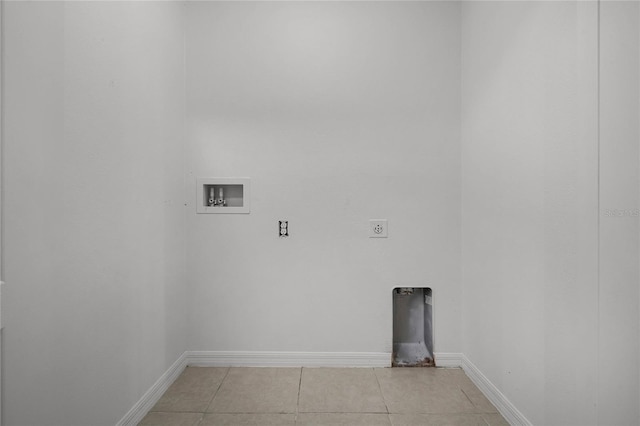 clothes washing area with washer hookup, light tile patterned floors, and hookup for an electric dryer