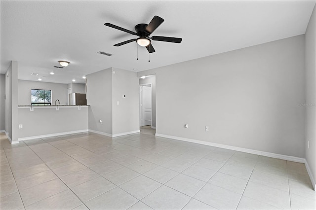 1952 Piedmont Ct, Mascotte, FL 34753 - unfurnished living room featuring ceiling fan, light tile patterned flooring, baseboards, and recessed lighting