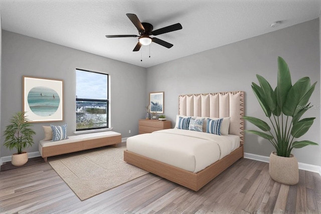 1952 Piedmont Ct, Mascotte, FL 34753 - bedroom featuring wood finished floors, baseboards, and ceiling fan