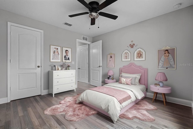 1952 Piedmont Ct, Mascotte, FL 34753 - bedroom with baseboards, wood finished floors, and ceiling fan
