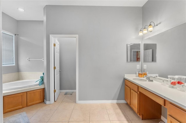 bathroom featuring vanity, tile patterned flooring, and a washtub