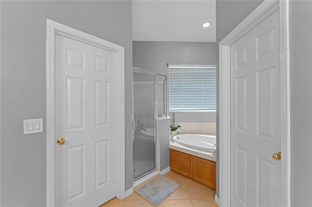 bathroom featuring separate shower and tub and tile patterned floors