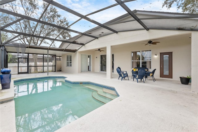 view of pool featuring ceiling fan, a lanai, and a patio