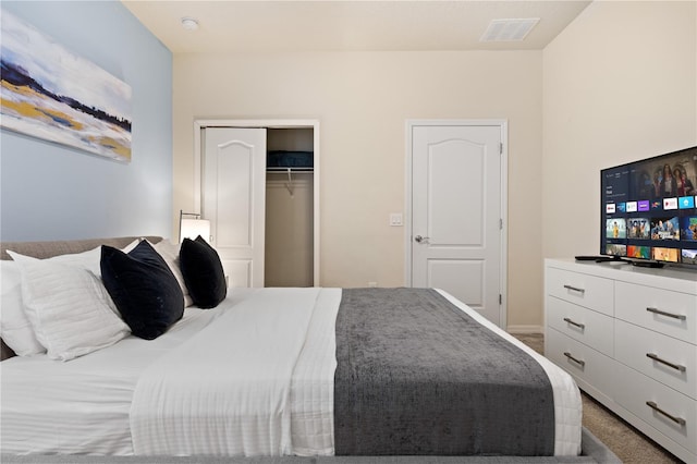 bedroom featuring a closet and carpet floors