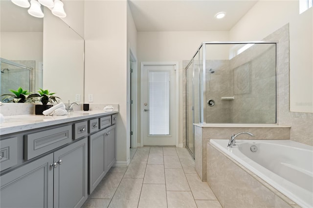 bathroom with separate shower and tub, tile patterned flooring, and vanity