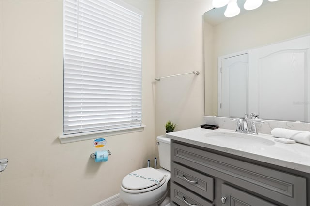 bathroom with toilet and vanity