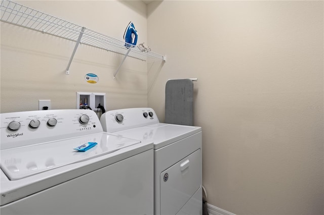 washroom featuring independent washer and dryer