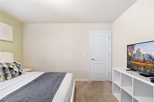 carpeted bedroom with a textured ceiling