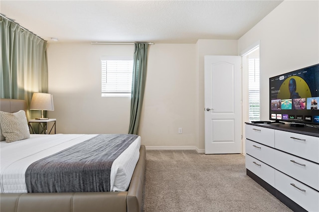 bedroom with light carpet