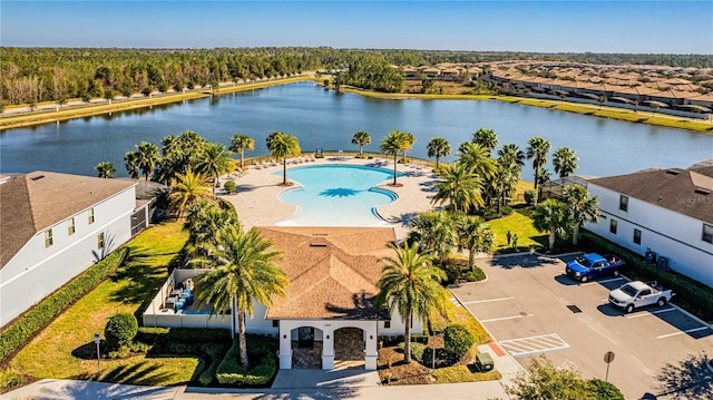 birds eye view of property with a water view