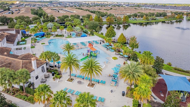 birds eye view of property featuring a water view