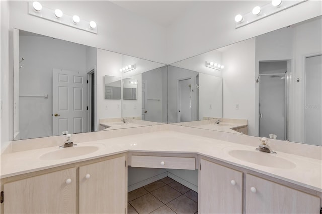 bathroom featuring vanity, tile patterned floors, and a shower with door