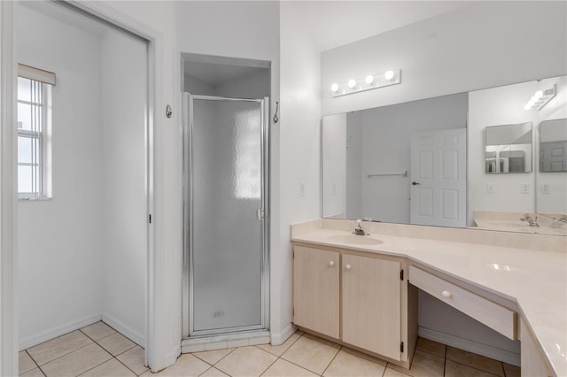 bathroom with vanity, tile patterned floors, and walk in shower