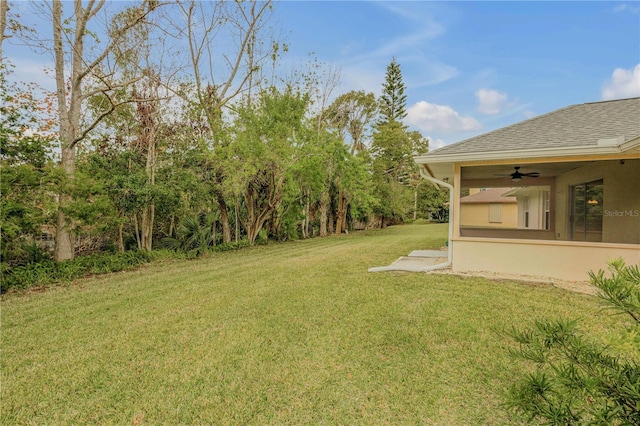 view of yard featuring ceiling fan