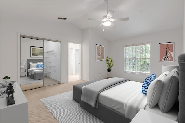 carpeted bedroom featuring vaulted ceiling, a closet, and ceiling fan