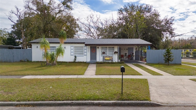 single story home featuring a front lawn