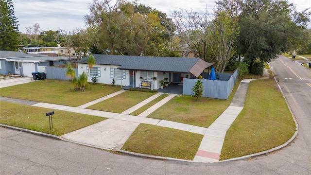 single story home with a front yard