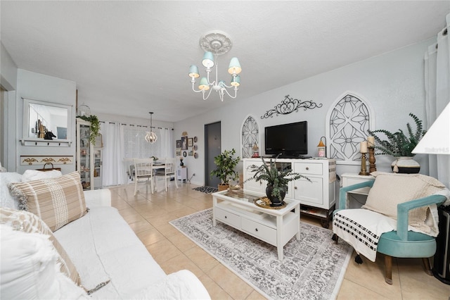 living room featuring light tile patterned floors, a chandelier, and a textured ceiling