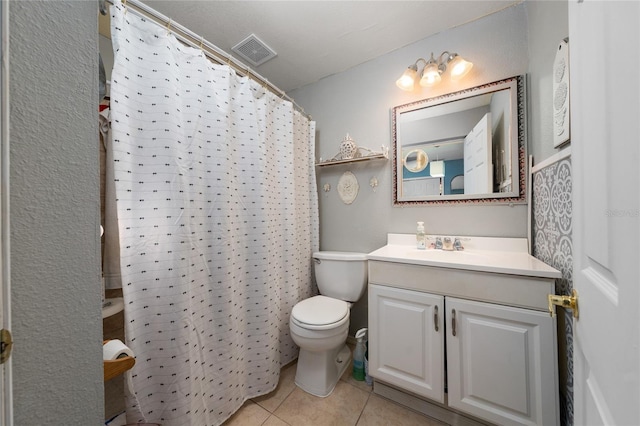 bathroom with toilet, tile patterned flooring, a shower with curtain, and vanity