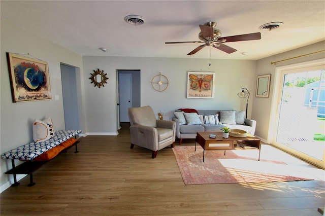 living room featuring ceiling fan and light wood-type flooring