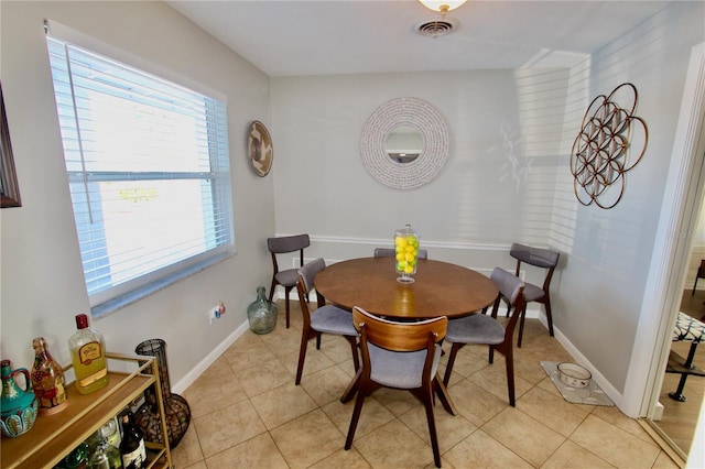 tiled dining area with a wealth of natural light