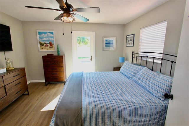 bedroom featuring ceiling fan and light hardwood / wood-style flooring