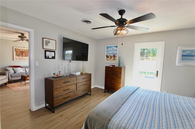 bedroom featuring ceiling fan and light hardwood / wood-style floors