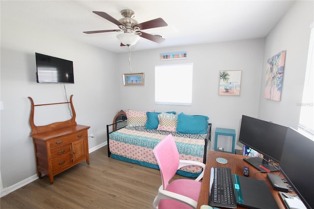 bedroom featuring ceiling fan and dark hardwood / wood-style flooring