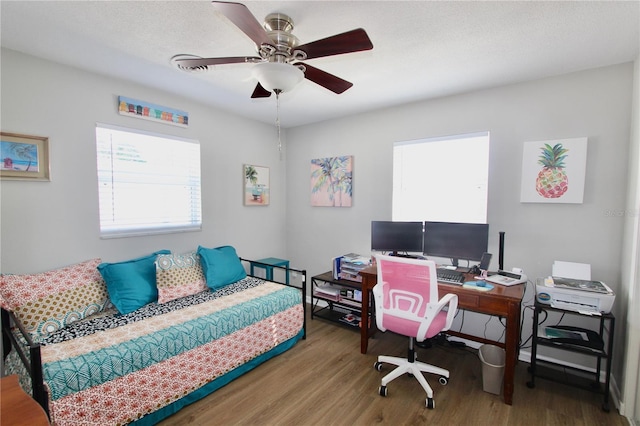 office space featuring hardwood / wood-style flooring and ceiling fan