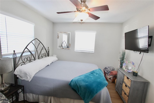 bedroom featuring ceiling fan and dark hardwood / wood-style flooring