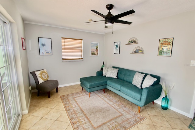 living room featuring ornamental molding, ceiling fan, and light tile patterned flooring