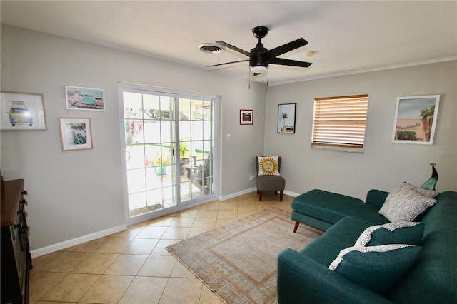 living room with ceiling fan and light tile patterned floors