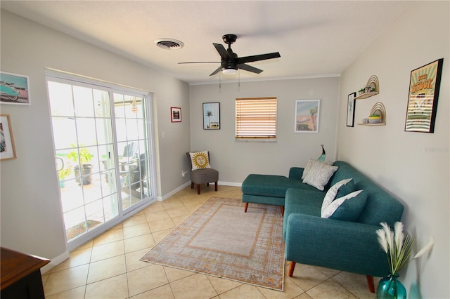 tiled living room featuring ceiling fan