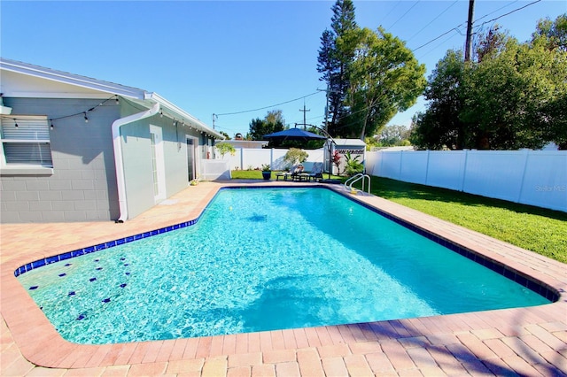 view of swimming pool with a patio