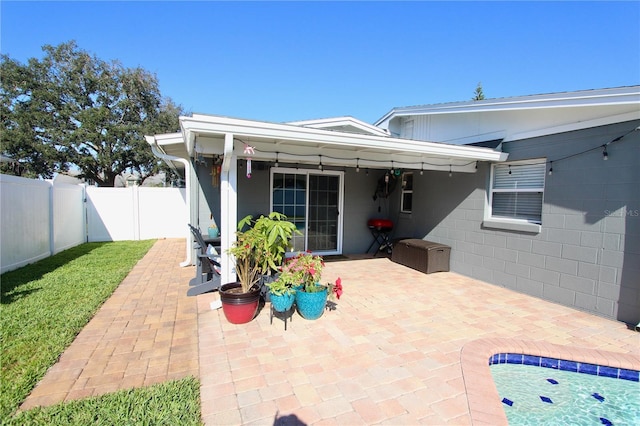 rear view of property featuring a patio