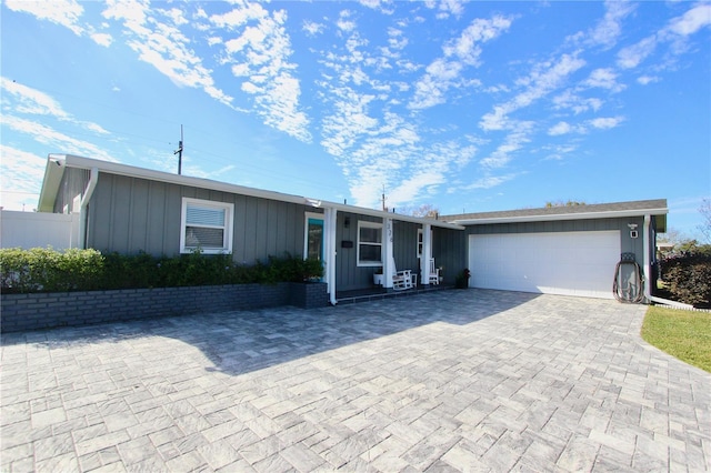 single story home featuring a garage