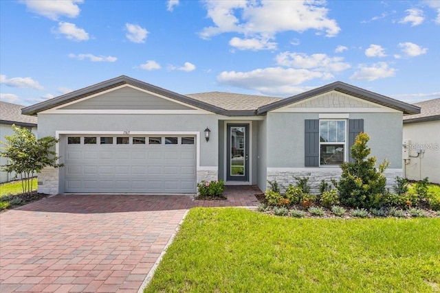 ranch-style home featuring a front yard and a garage