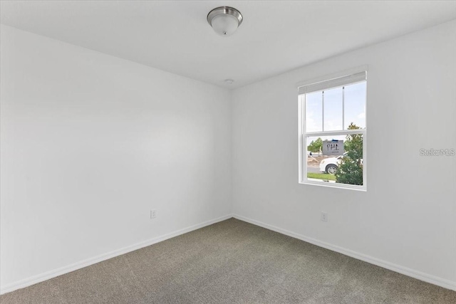 unfurnished room featuring carpet floors