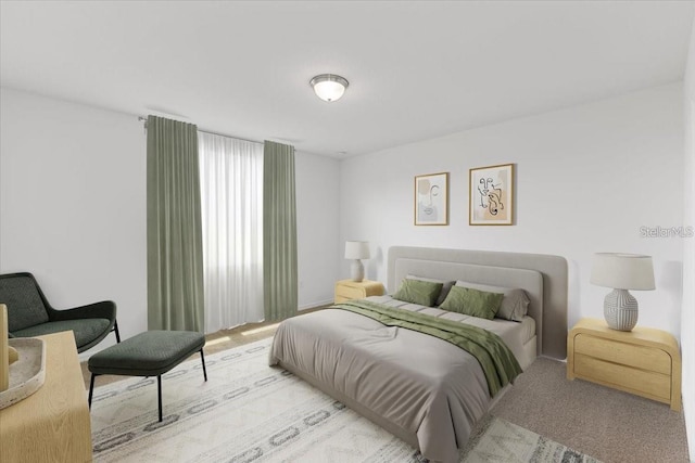 bedroom featuring light colored carpet