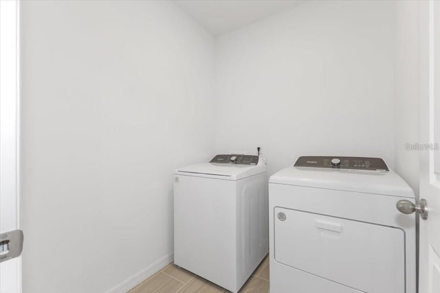 laundry room with washer and clothes dryer