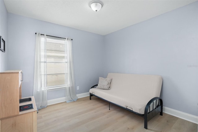 sitting room with light hardwood / wood-style flooring