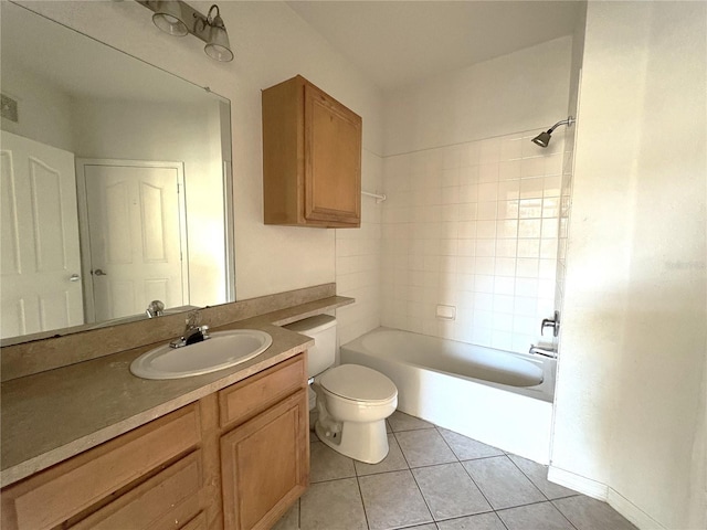 full bathroom featuring toilet, vanity, tile patterned floors, and shower / bathing tub combination