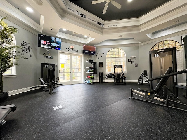 exercise room with a towering ceiling, a wealth of natural light, and french doors